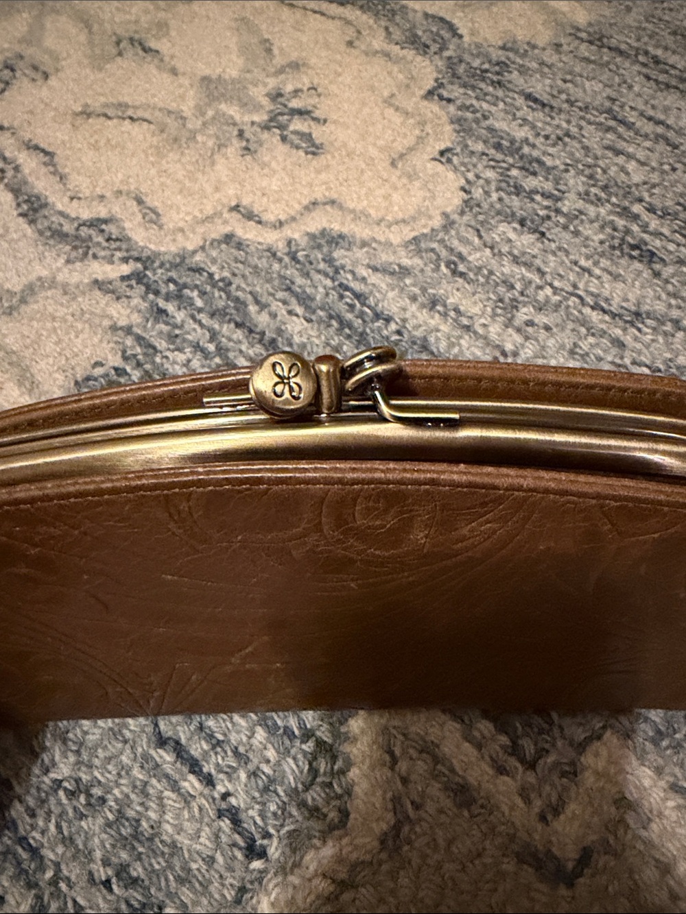 HOBO Brown Leather Wallet with Floral Embossing and Brass Frame